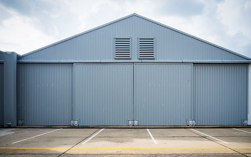 Hangar door installation service repair on hydraulic doors - powerlift - Northwest U.S.A